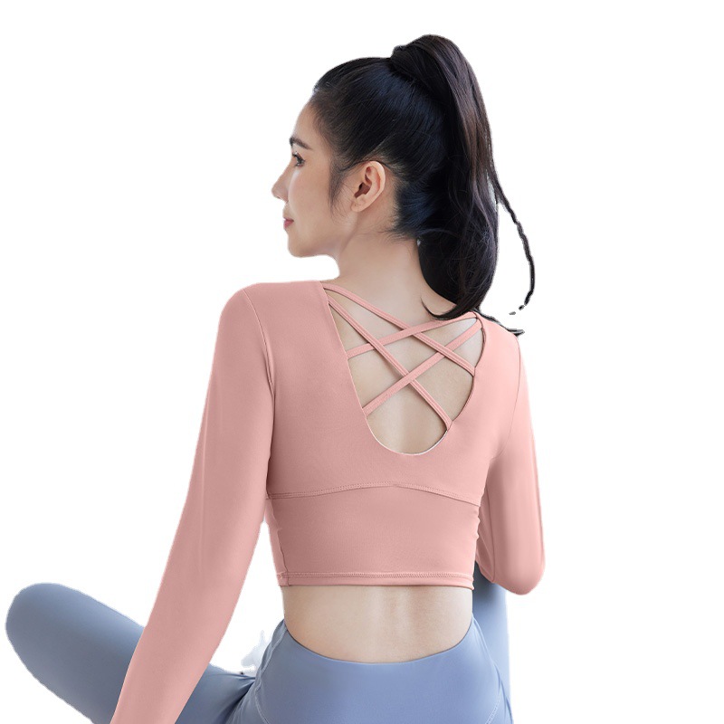 Peach-colored back cross bra with long sleeves - in-use view