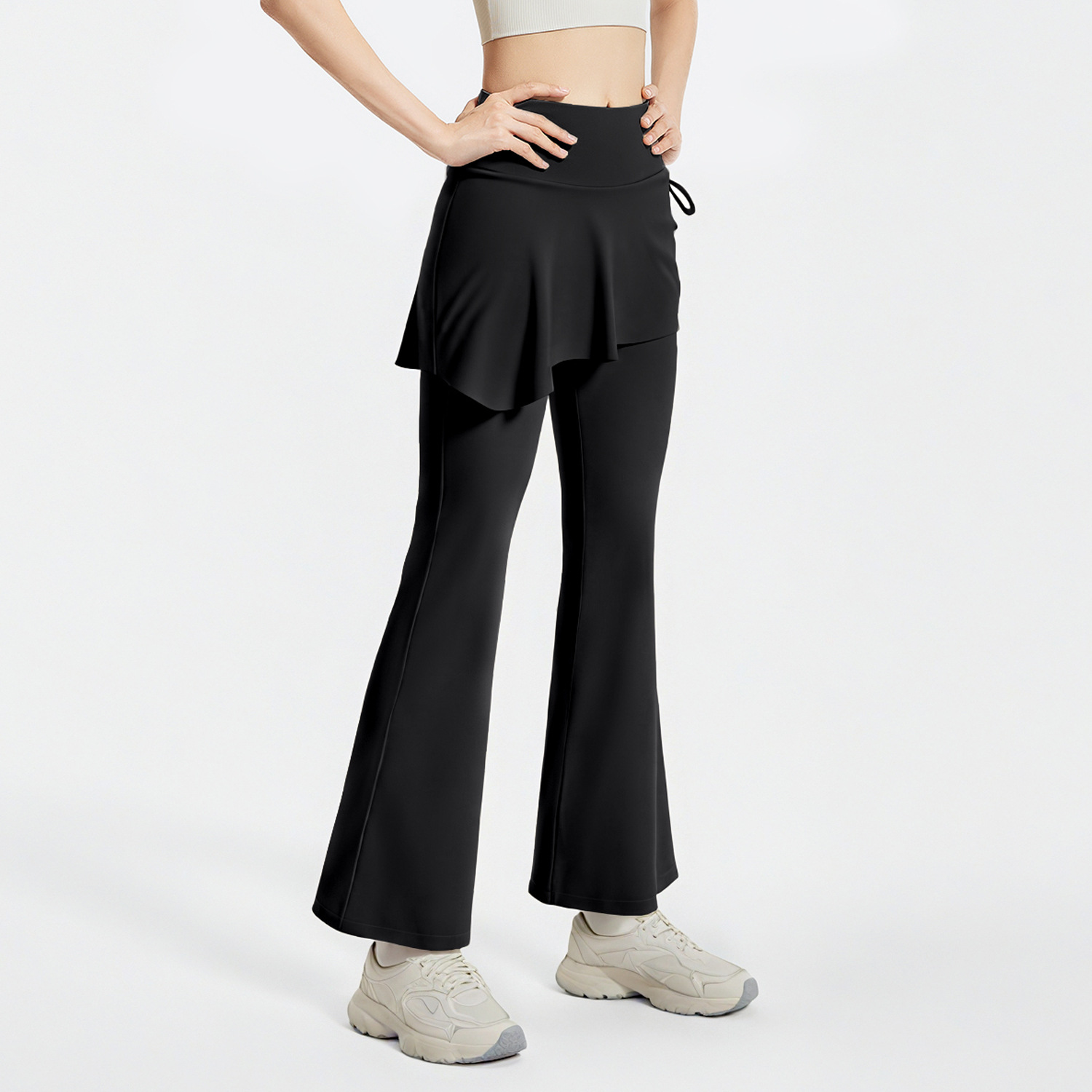 Peach-colored pleated culottes - detail view