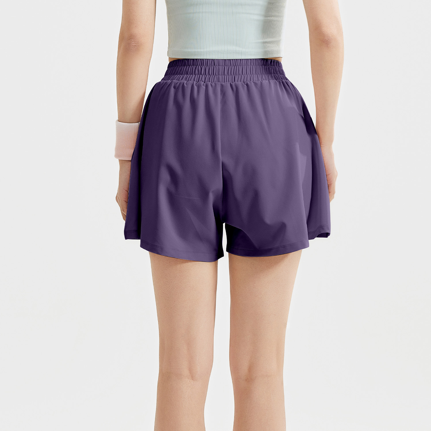 Peach-colored pleated shorts - in-use view