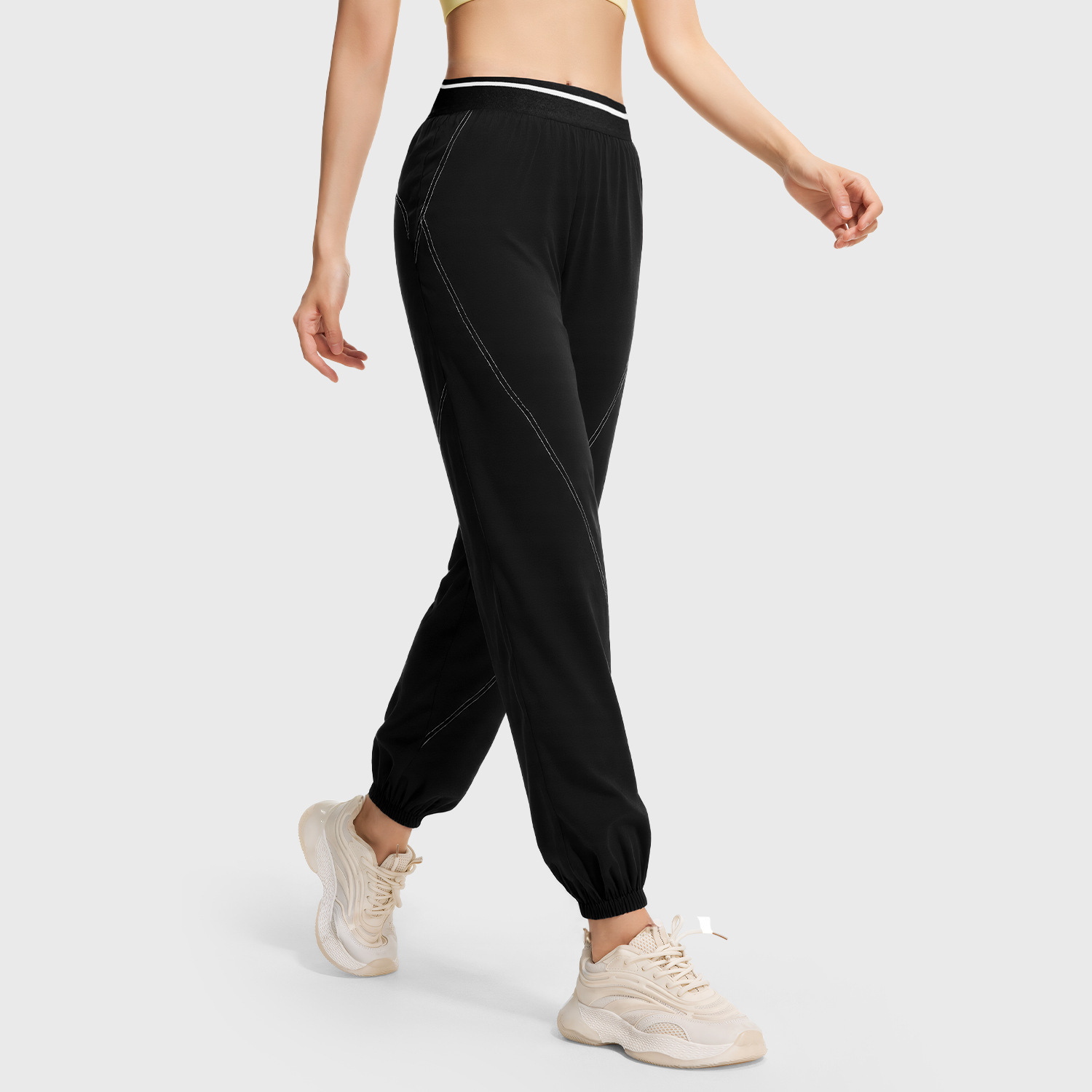 Peach-colored button-front slim pants - detail view