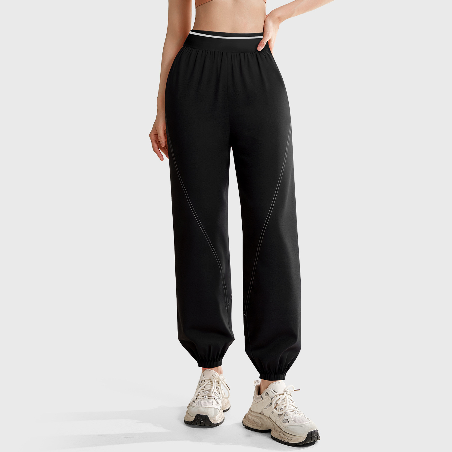 Peach-colored button-front slim pants - side view