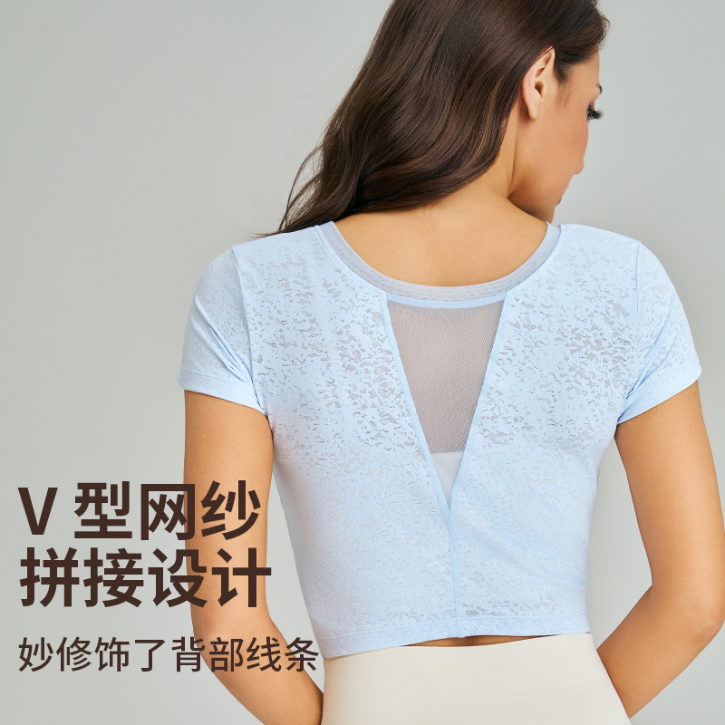 Vermann's new yoga short-sleeved top - a sexy, twisted, high-waisted sports t-shirt with V-shaped mesh design and a beautiful back view, perfect for quick-drying fitness wear. - side view