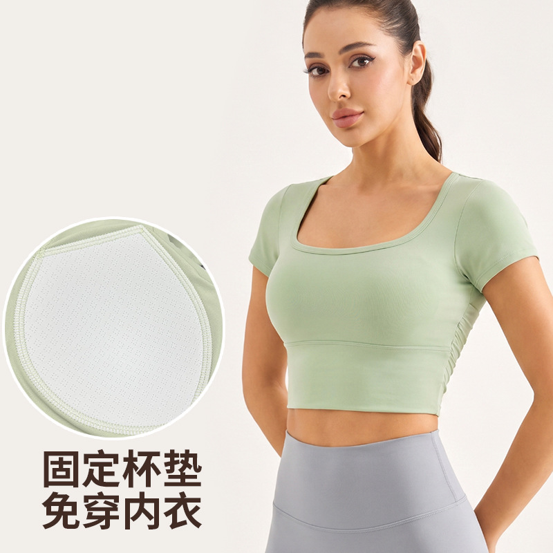 Sportive short-sleeved women's net fabric patchwork short style slimming fitness top professional integrated cup Pilates training yoga suit - side view